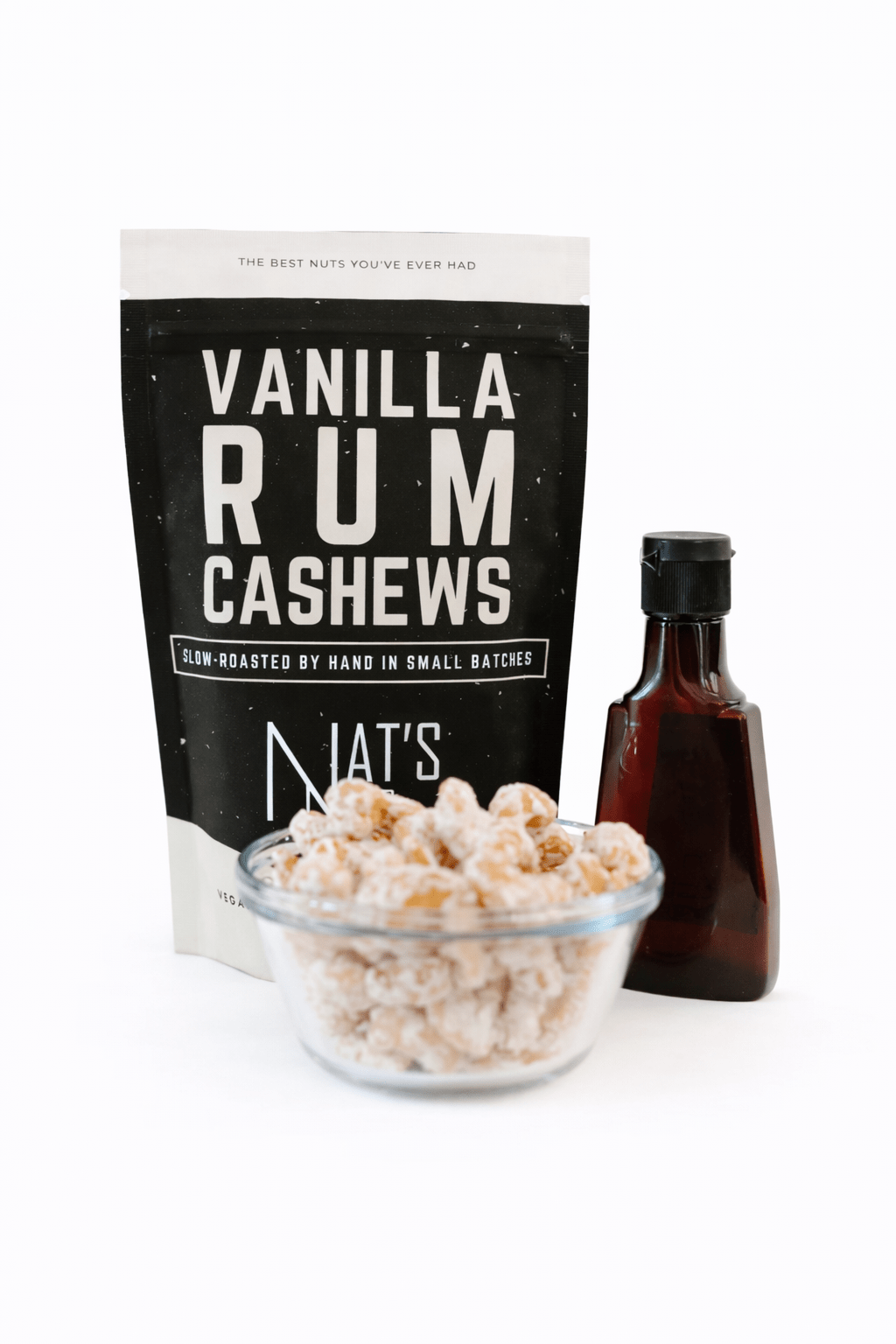 Vanilla Rum Cashews packaging with cashew bowl and bottle on white background