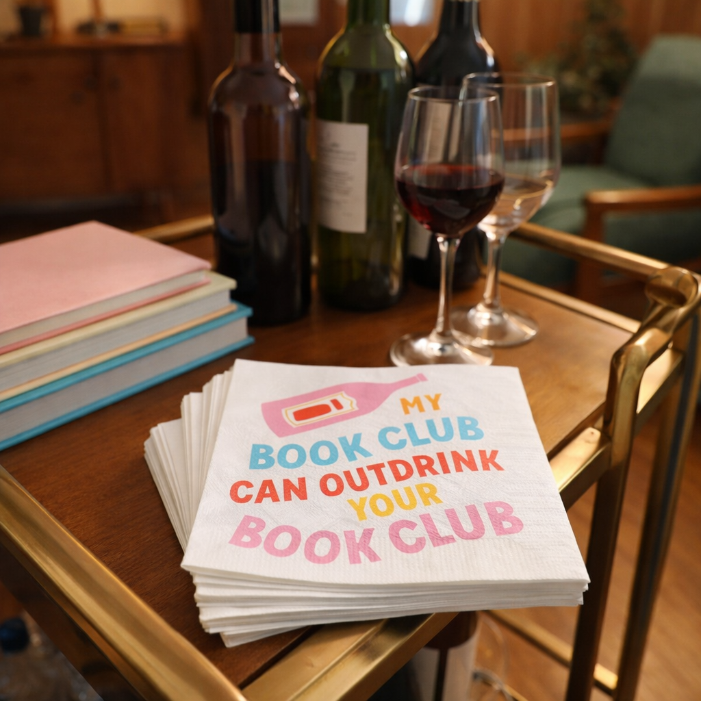 My Book Club Can Outdrink Your Book Club napkins displayed with wine glasses on bar cart