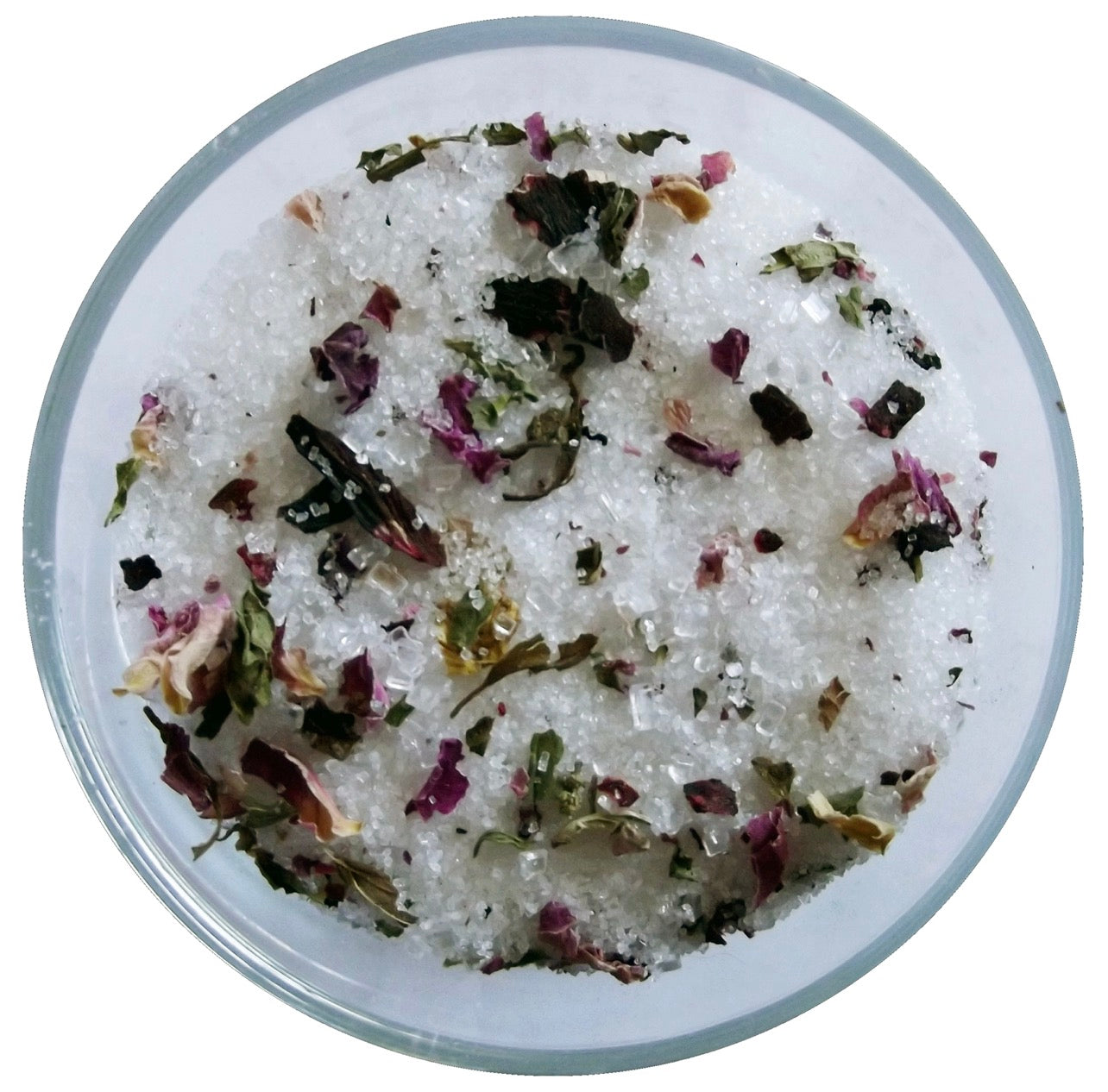 Close-up of citrus and floral cocktail rim sugar with rose petals, hibiscus, and sugar crystals.