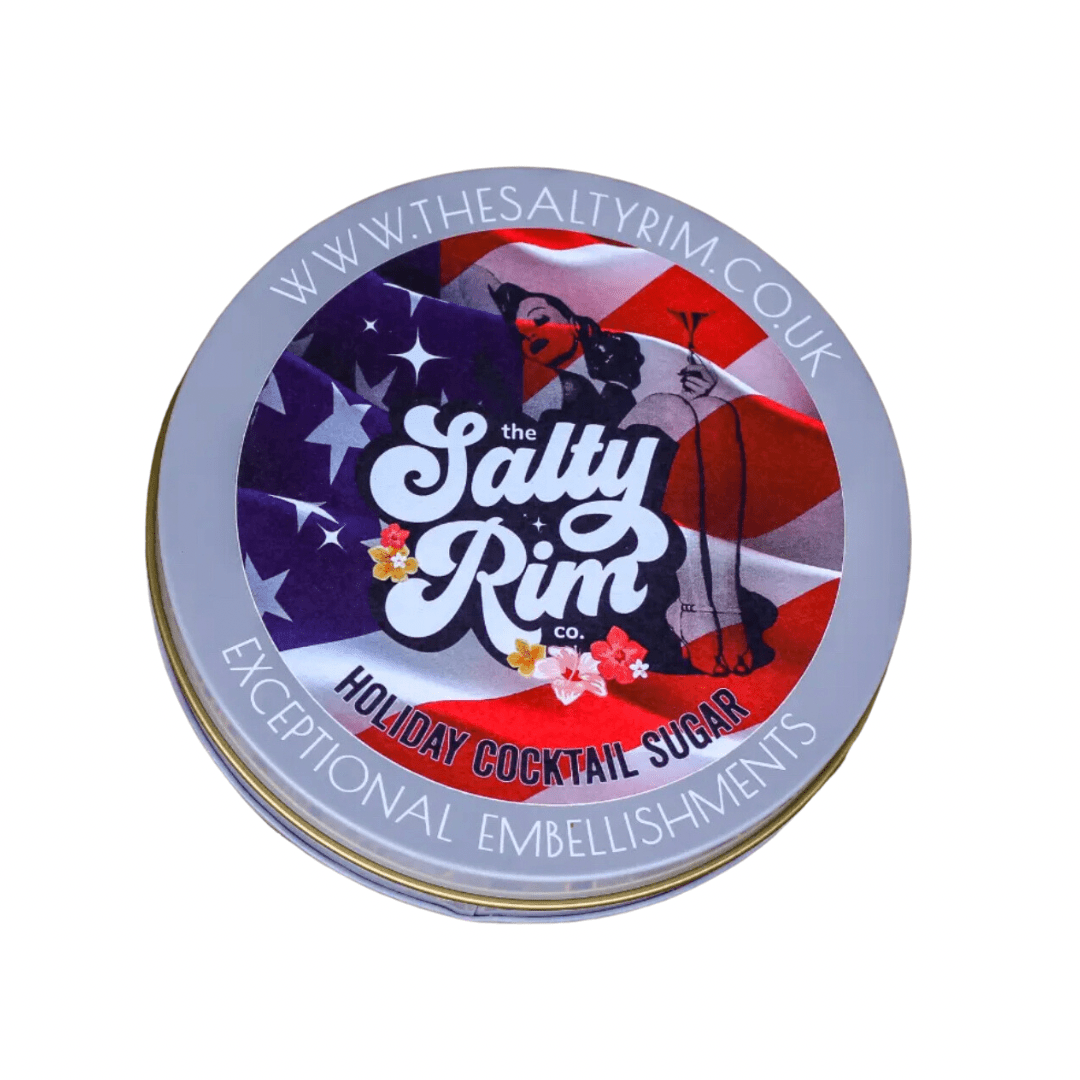 A container of Holiday Cocktail Sugar Rimmer with red, white, and blue color scheme, designed for rimming cocktail glasses.