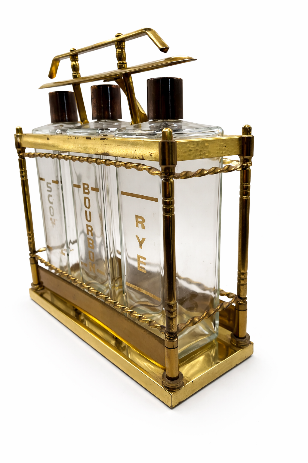 Side view of vintage brass locking liquor decanter set with three glass bottles