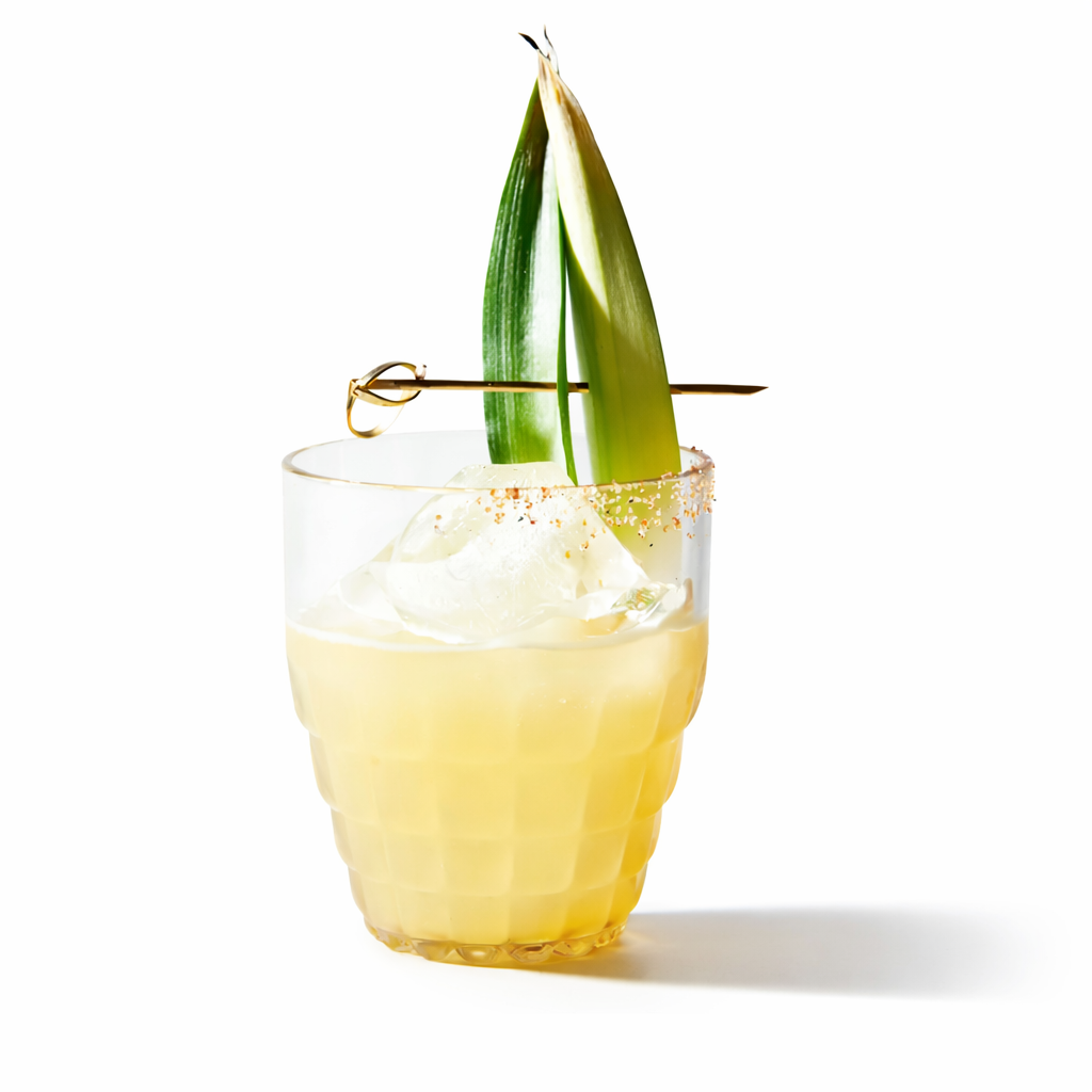 Tiki cocktail made with pineapple lime mixer in rocks glass with garnish and ice.