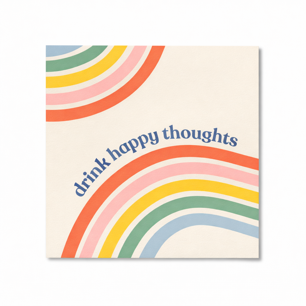 Retro rainbow cocktail napkin with the phrase “drink happy thoughts” displayed on a white background.