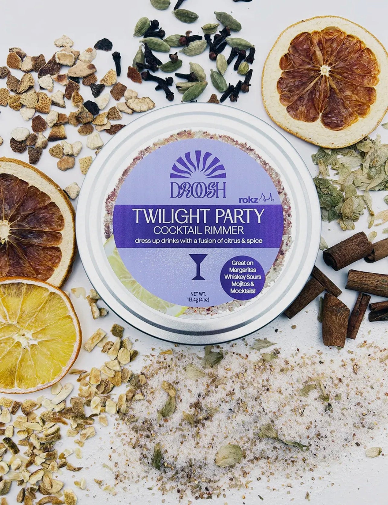 Twilight Party Cocktail Sugar Rimmer surrounded by dried citrus, spices, and sugar crystals.