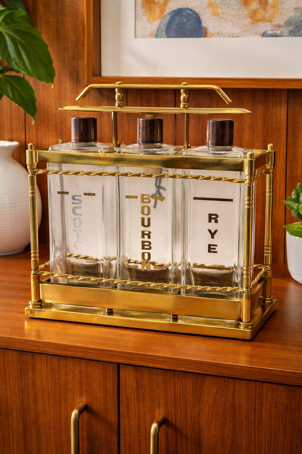 Vintage brass liquor decanter set styled on walnut mid century modern cabinet