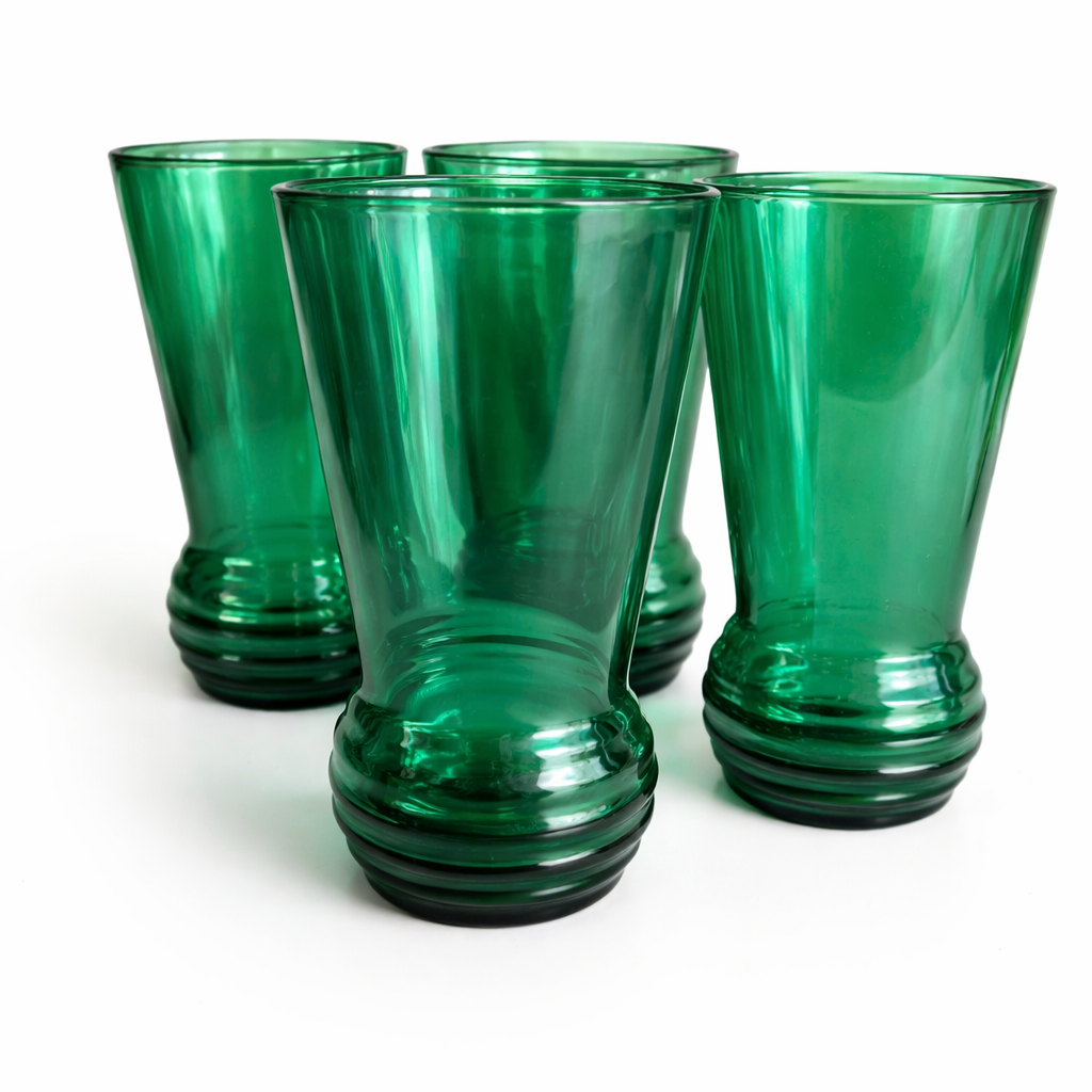 Set of six vintage emerald green mid-century cocktail glasses with flared shape and stepped base