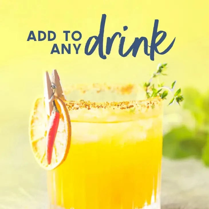 golden cocktail in a short glass rimmed with sugar and a dehydrated lemon wheel pinned to the rim