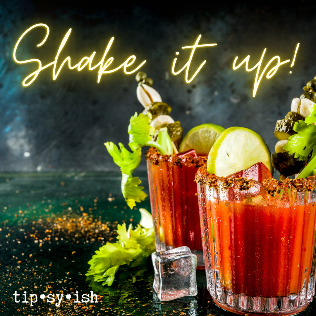 bloody mary drinks with several garnishes extending from the glasses