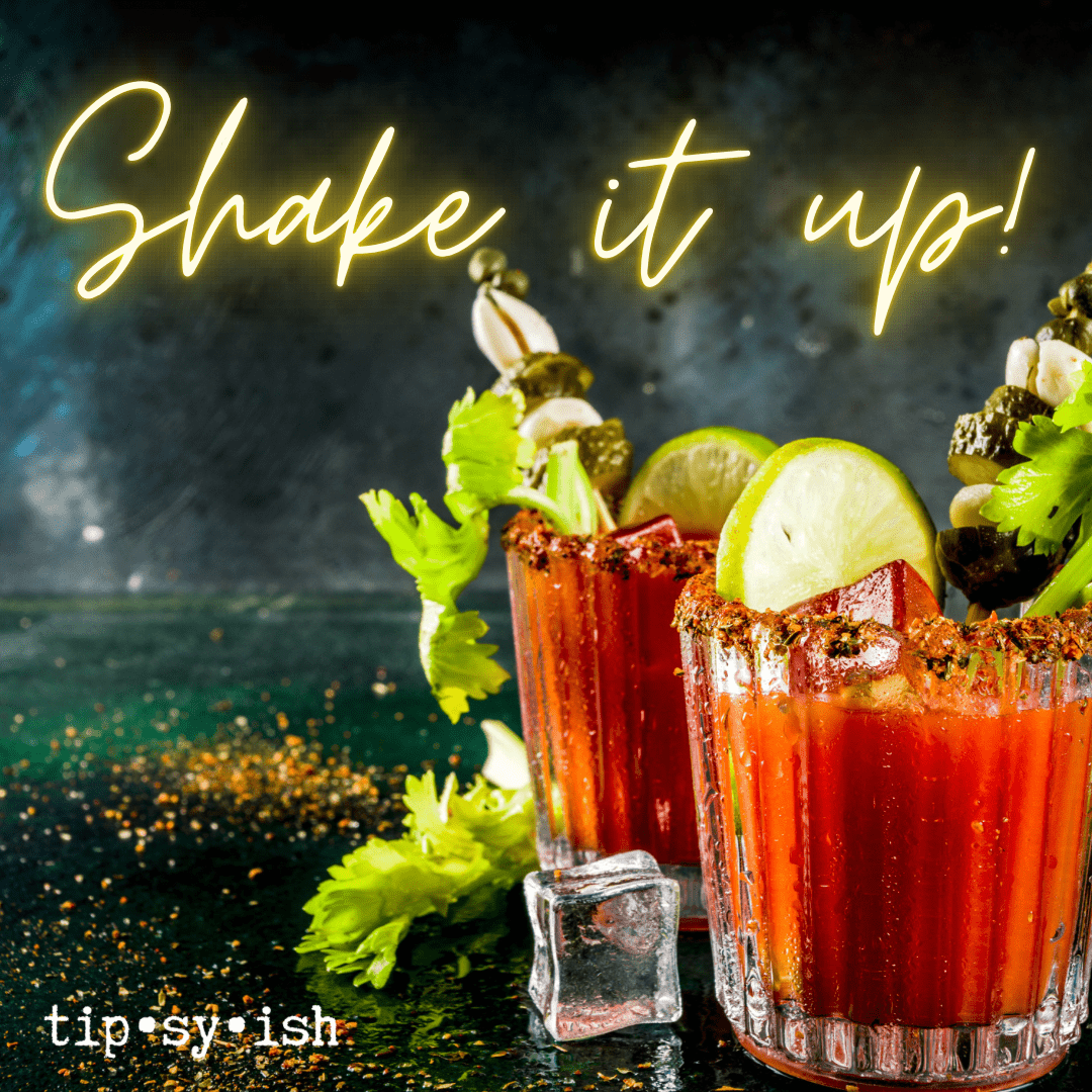 bloody mary drinks with several garnishes extending from the glasses
