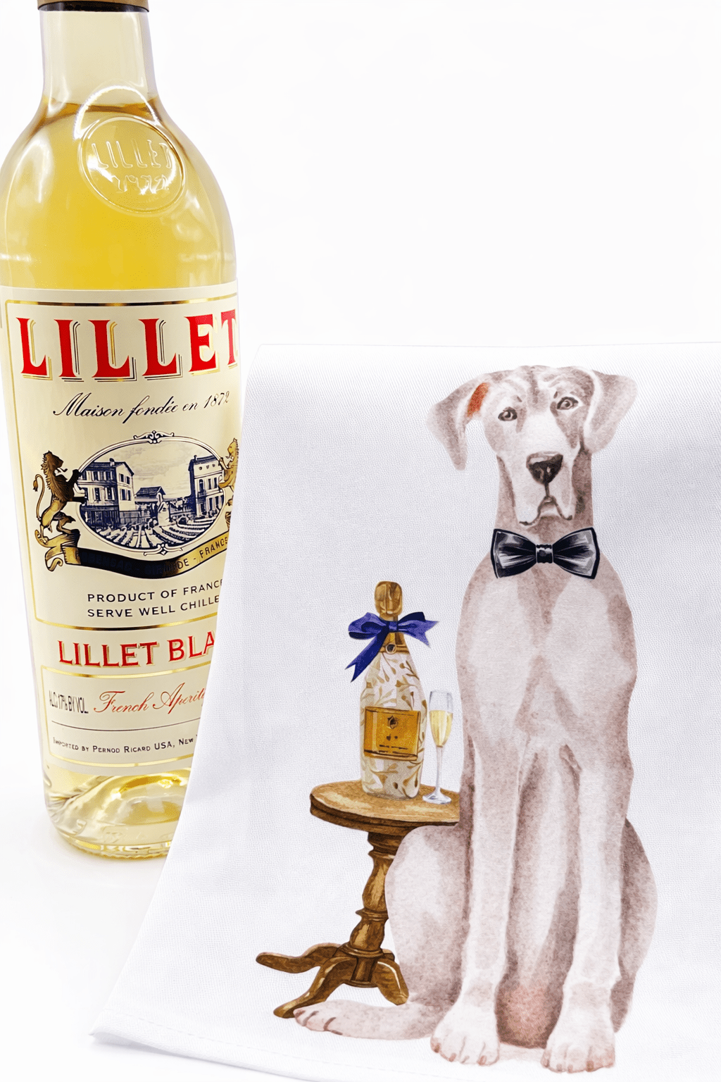 Lillet Blanc bottle with a decorative towel featuring a dog and bottle design.