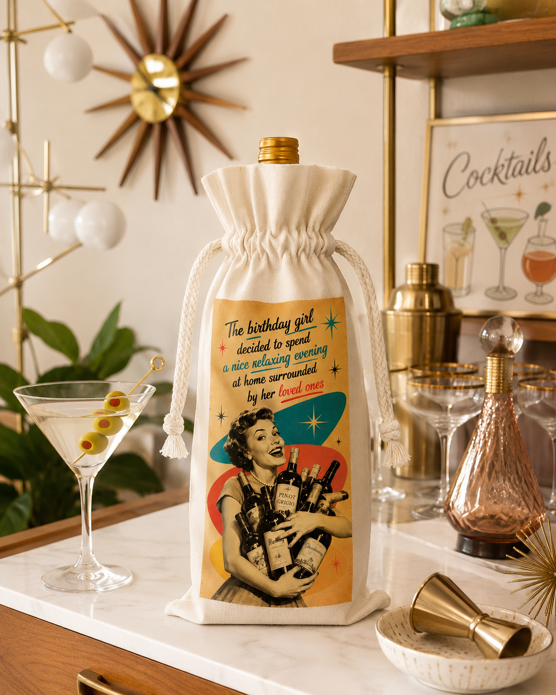 Reusable birthday wine bag displayed on a midcentury modern home bar with martini glass and vintage cocktail accessories.