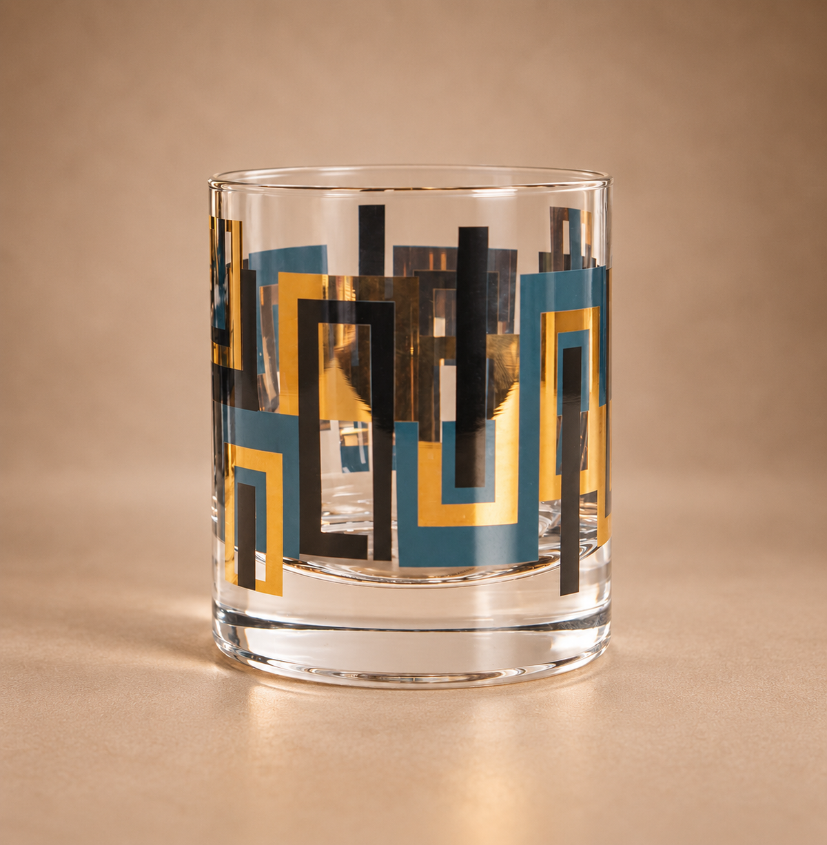 Blue and gold mid century modern 10 oz whiskey rocks glass with black geometric accents and weighted crystal base