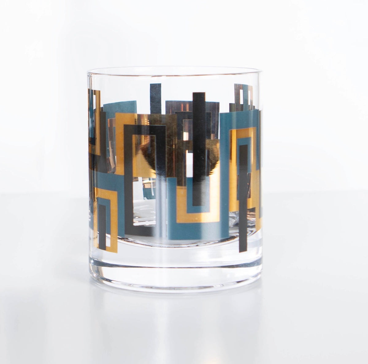 Blue and gold mid century modern 10 oz whiskey rocks glass with black geometric accents and weighted crystal base