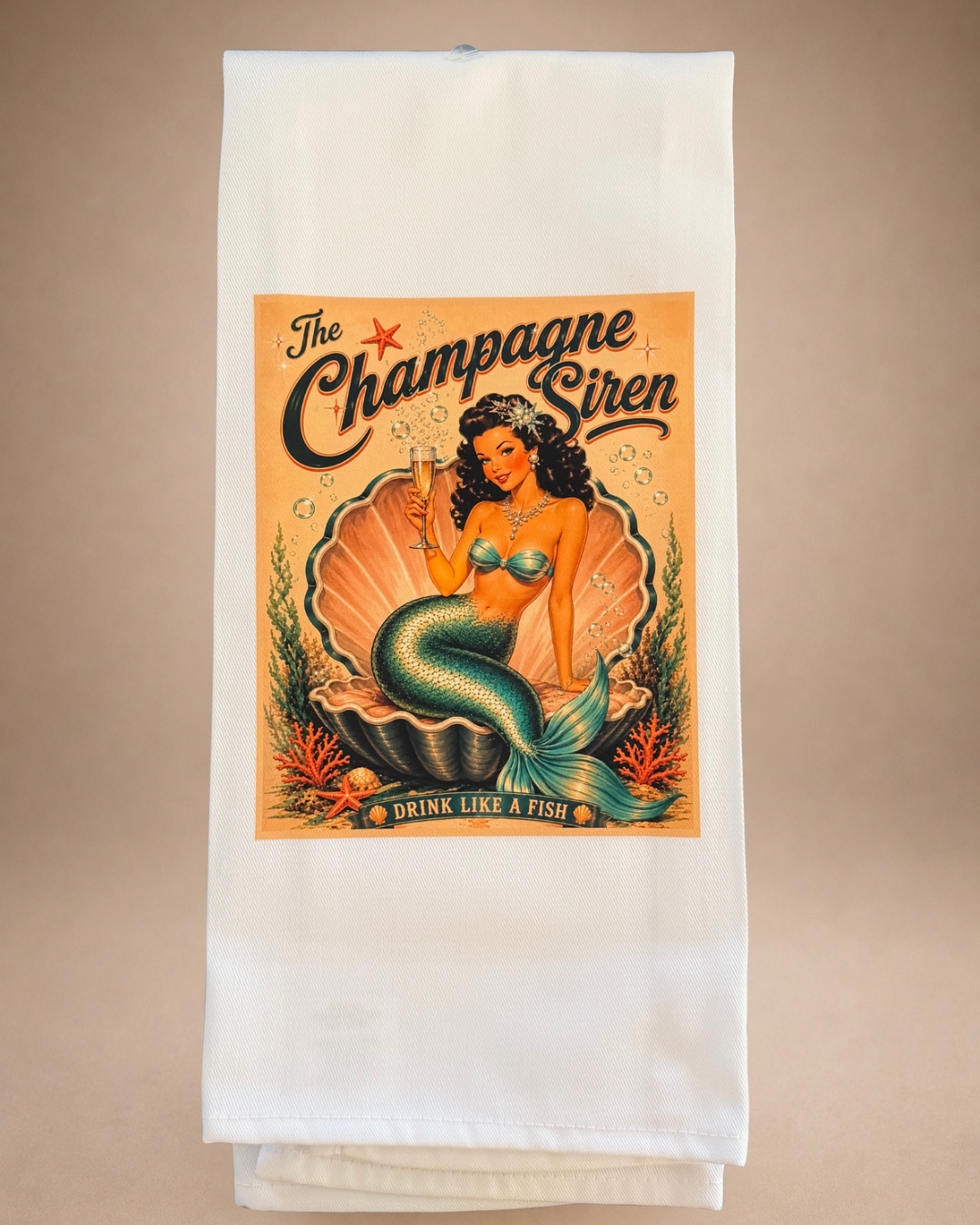 Retro mermaid tea towel featuring The Champagne Siren holding a champagne glass with Drink Like a Fish artwork.