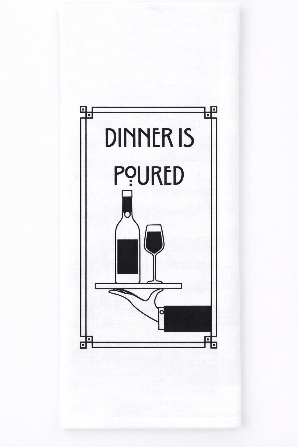 White tea towel with black text “dinner is poured”