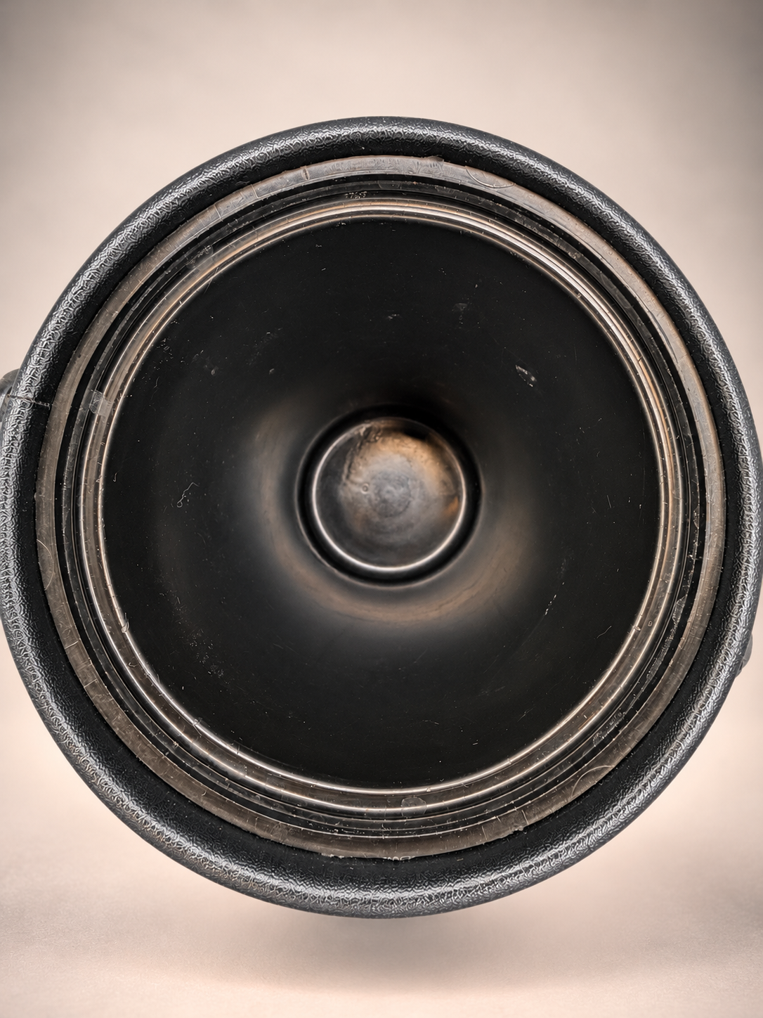 Overhead view of vintage Elmar ice bucket interior showing black liner and visible signs of previous use.