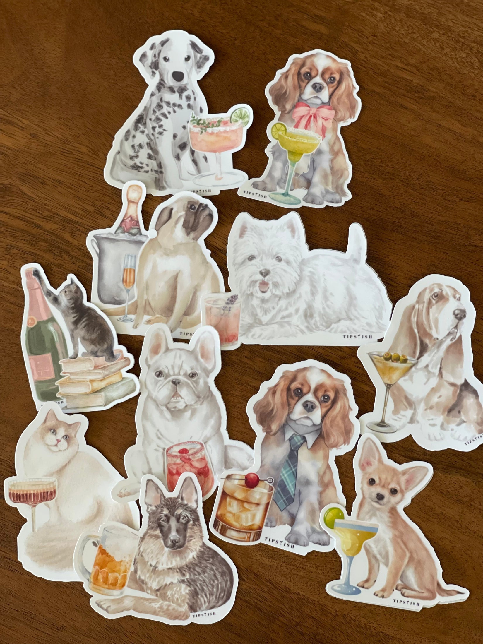 Set of dog-themed stickers on a wooden surface