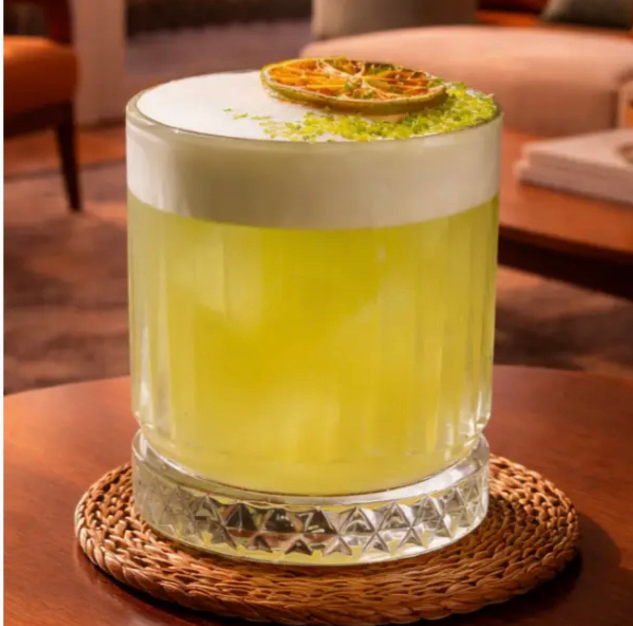 Cocktail garnished with a dried lime wheel from McMann & Tate for cocktails and mocktails
