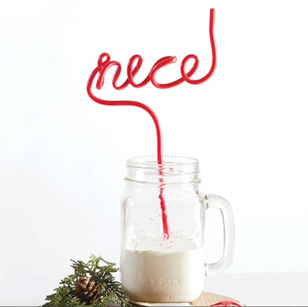 example of the "nice" christmas straw being used in a glass of milk