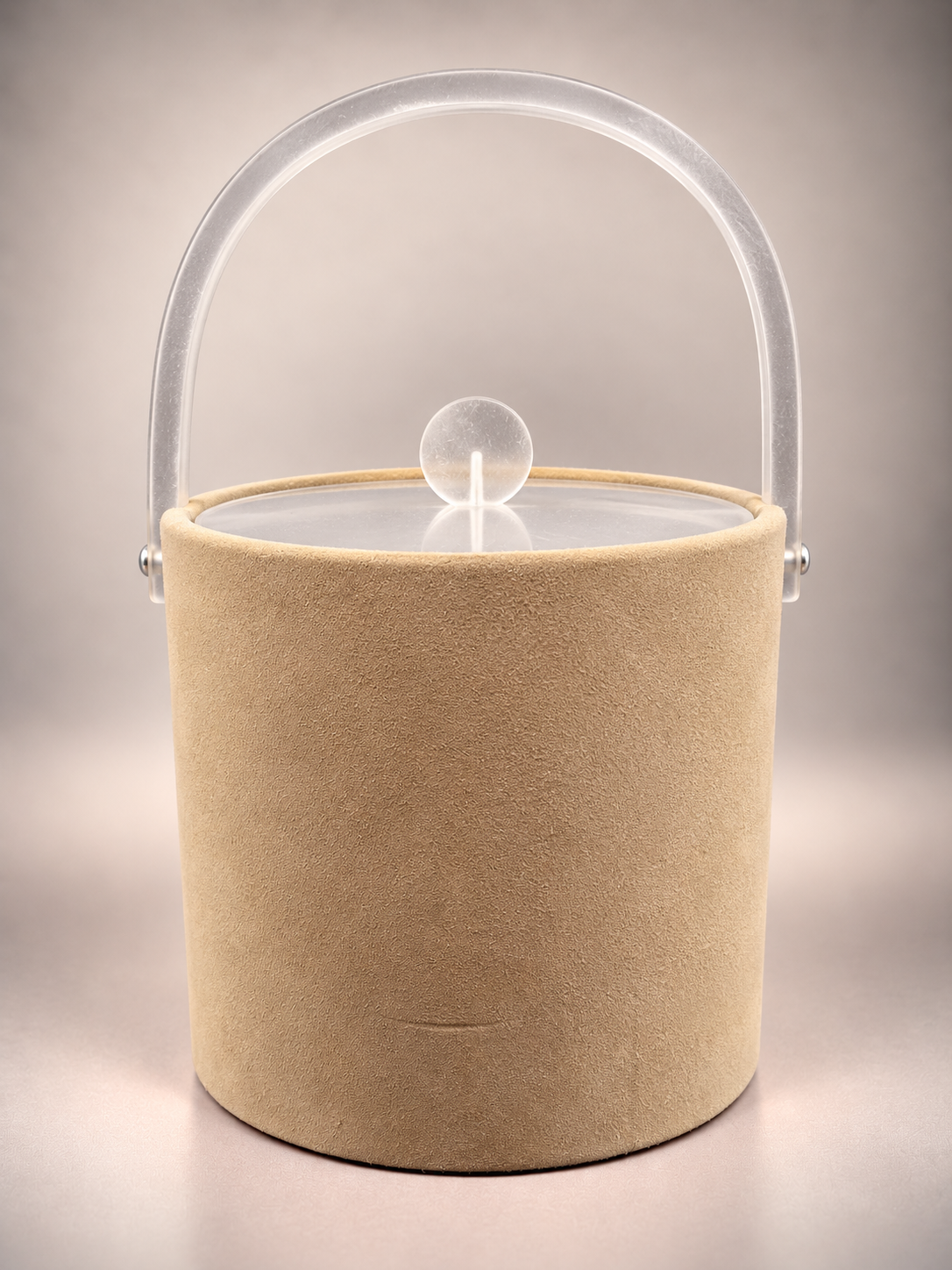 Front view of beige Georges Briard ice bucket showing raised translucent swing handle and matching frosted lid knob.