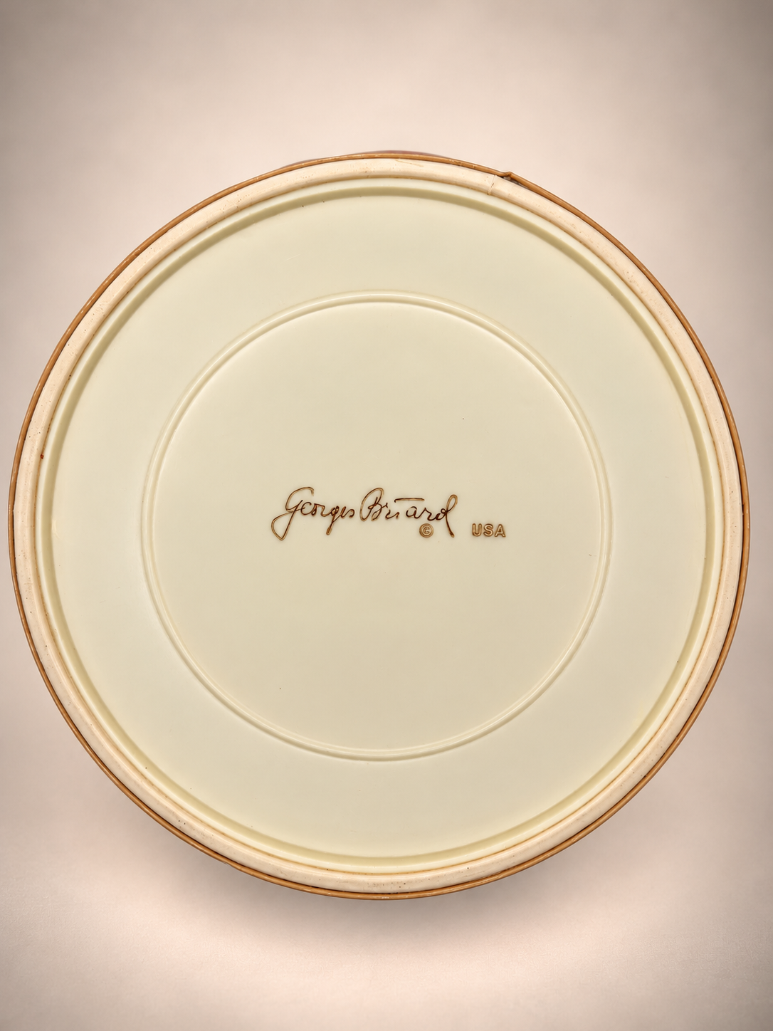 Underside of vintage ice bucket showing the original Georges Briard USA signature.