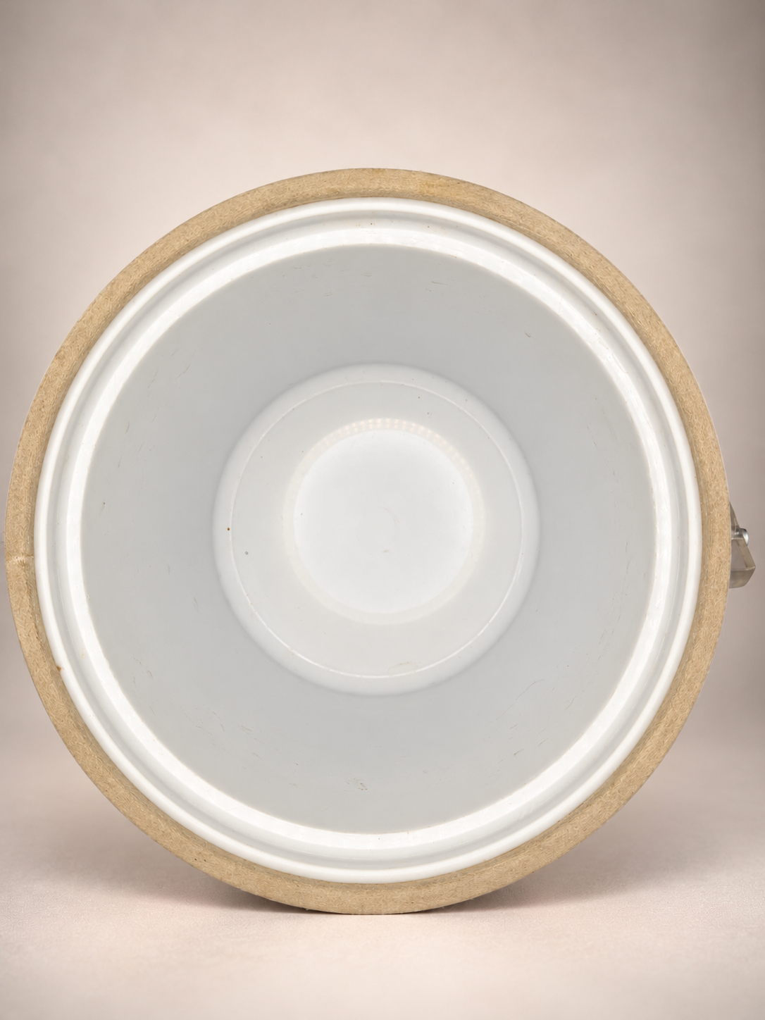 Overhead view of vintage Georges Briard ice bucket showing white interior liner with light scratches and signs of previous use.