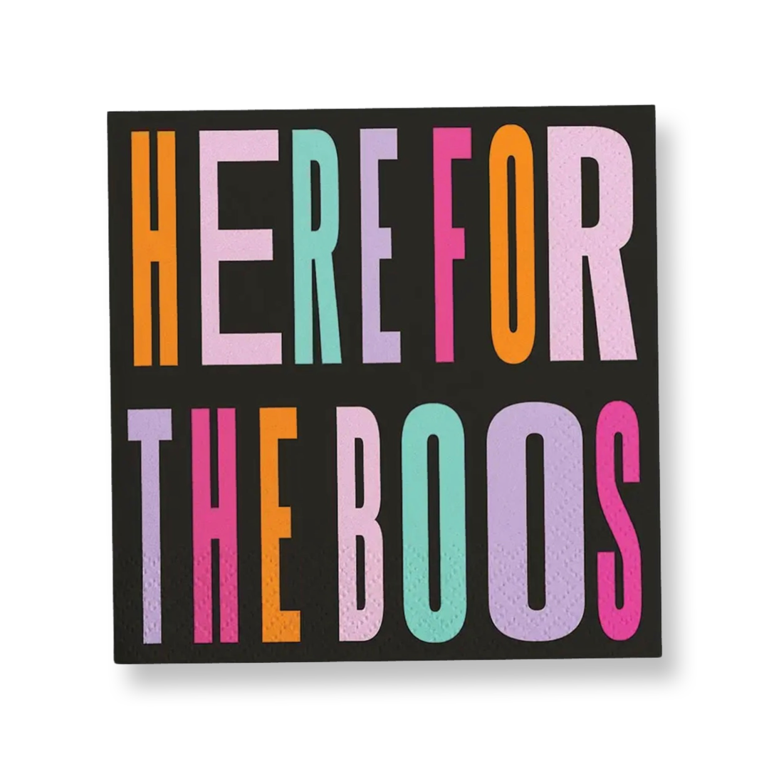 Black Halloween cocktail napkins featuring colorful retro lettering that reads Here for the Boos in orange, pink, lavender and aqua.