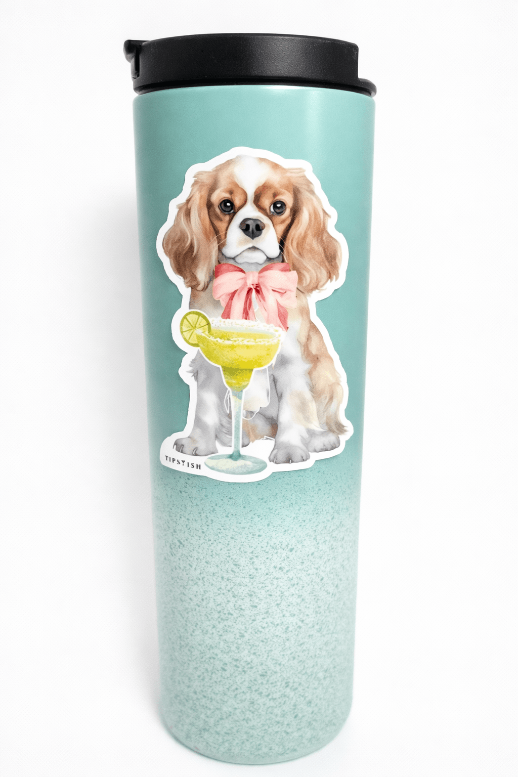 Tumbler with a dog design holding a martini on a light blue background