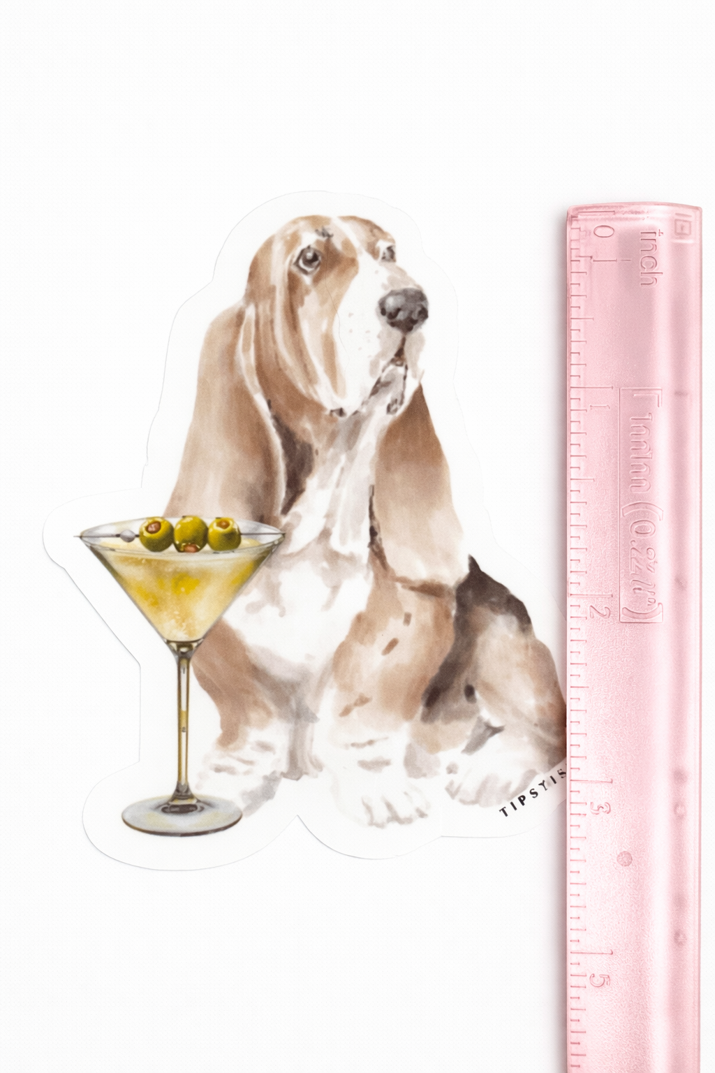 Sticker of a dog with a cocktail and a ruler for scale on a white background