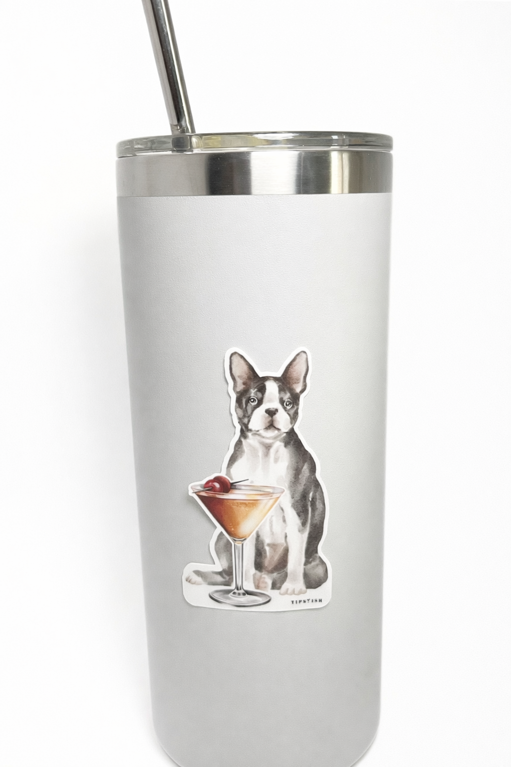 Tumbler with a dog design holding a cocktail on a white background