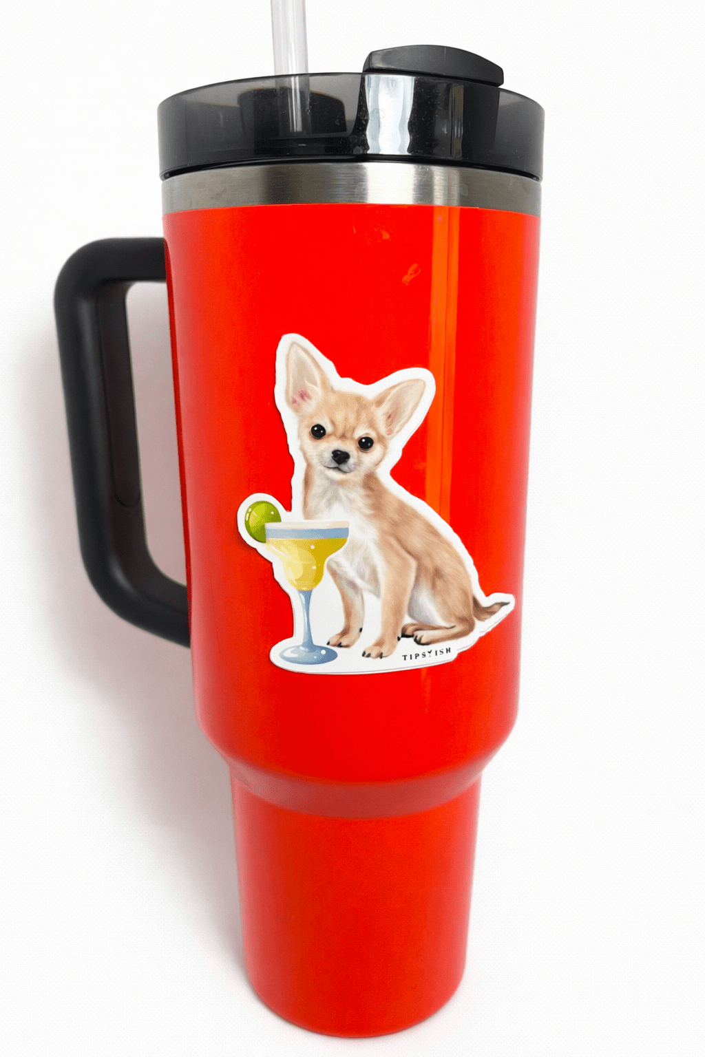 Red travel mug with a dog illustration holding a cocktail on a white background