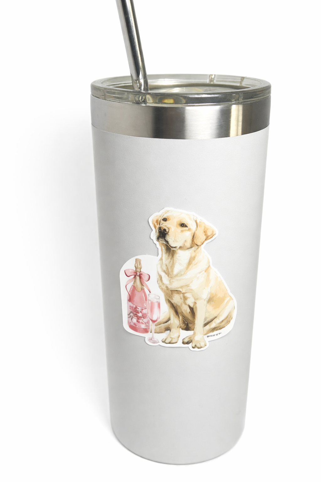 Grey tumbler with a dog sticker and pink bottle design on a white background