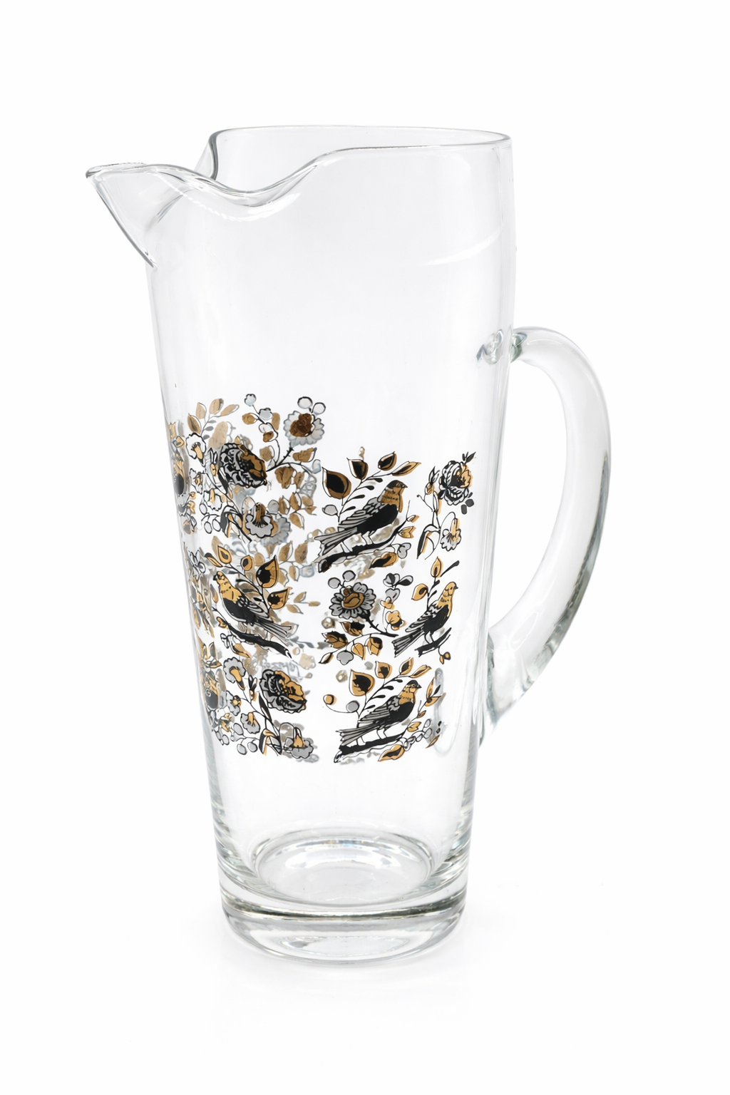 Clear glass pitcher with floral and bird design on a white background
