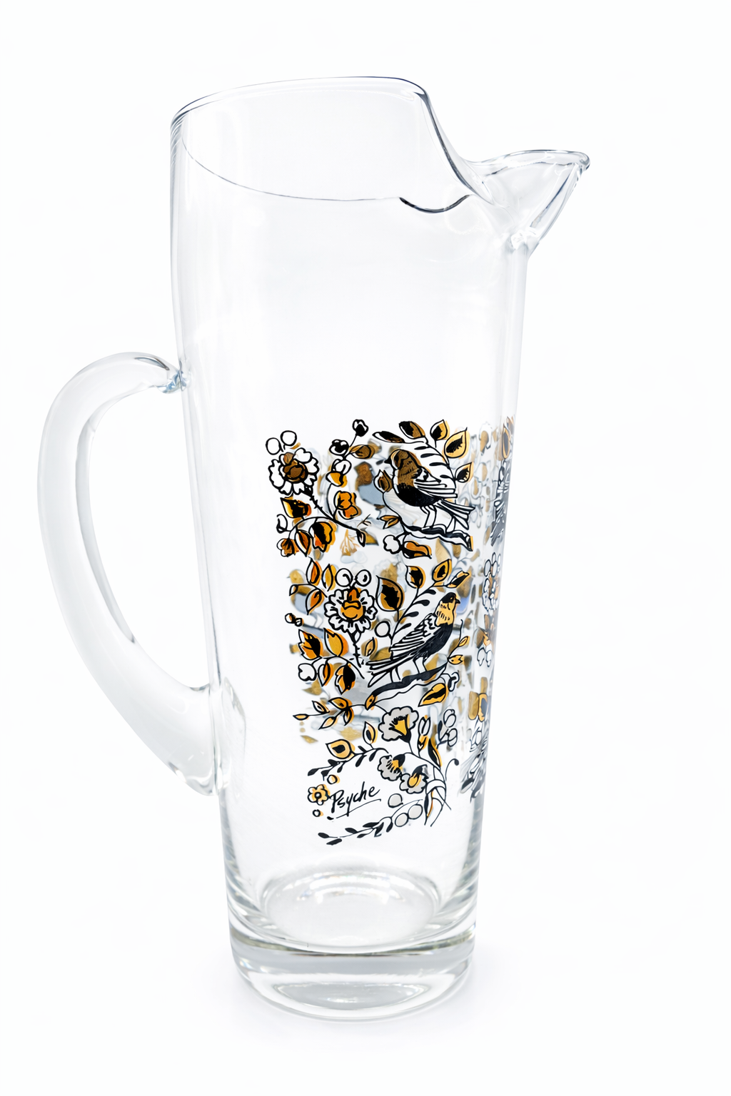 Clear glass pitcher with floral design on a white background