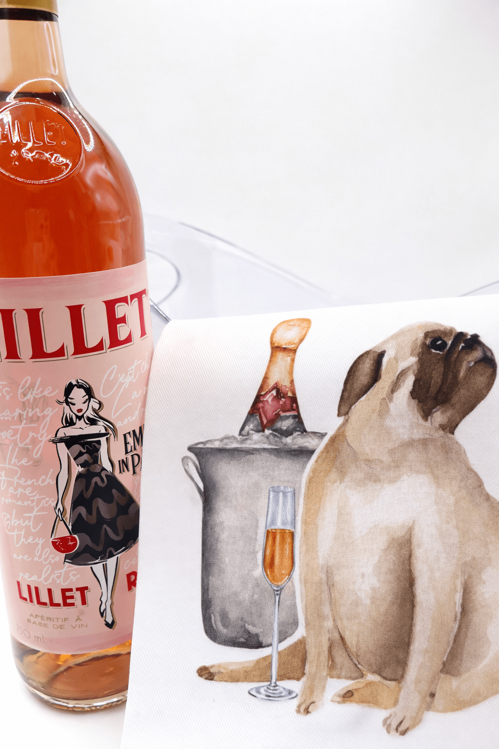 Lillet bottle with a dog-themed product in the background