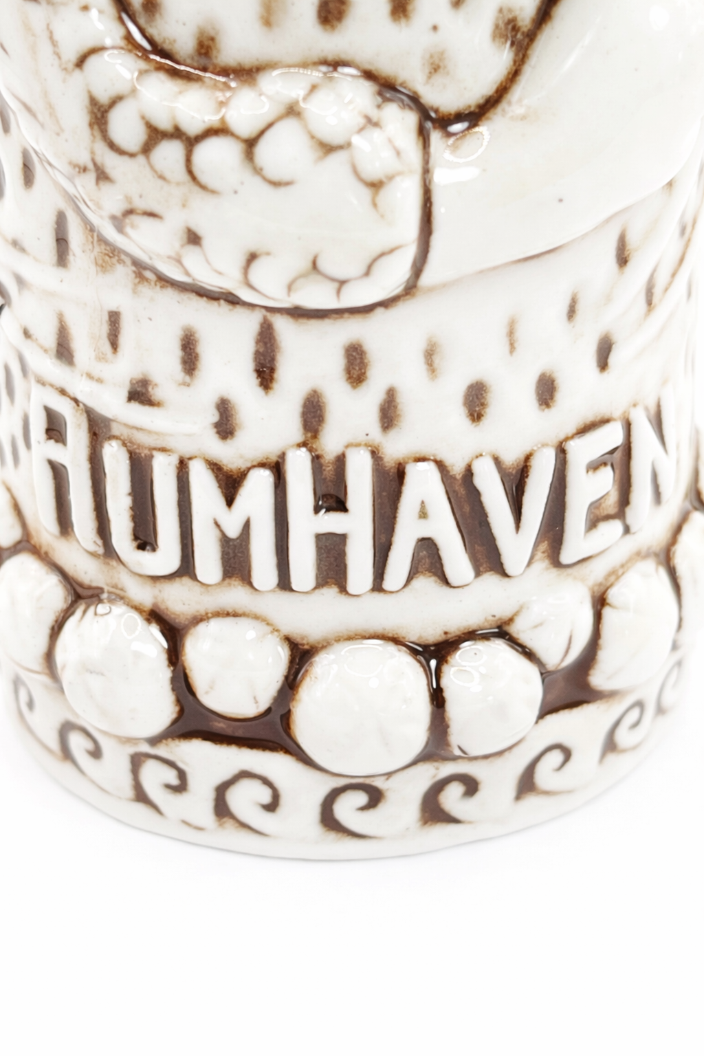 Detail view of the side of a RumHaven tiki mug by Tiki Rob highlighting sculptural ceramic design