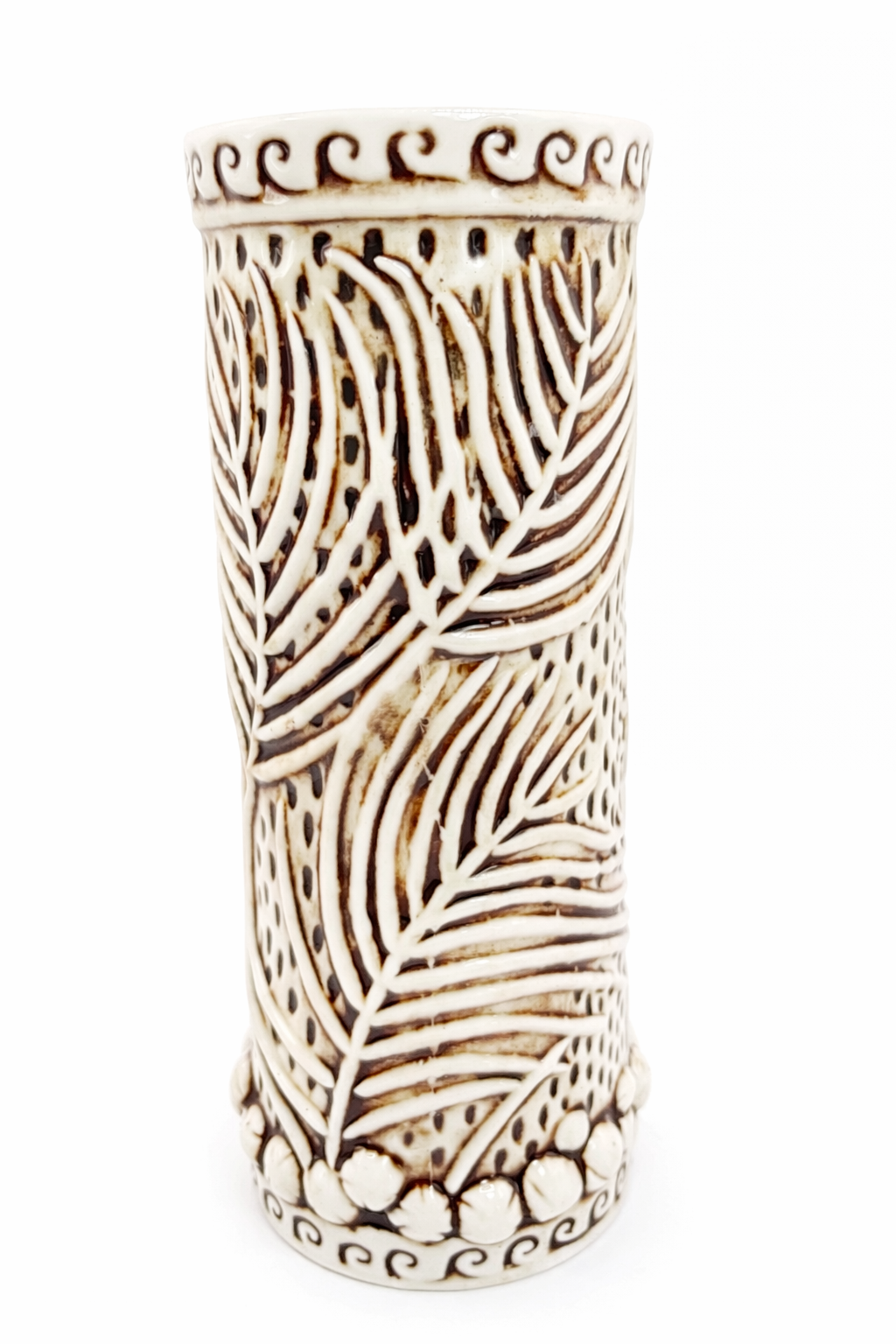 Back view of a RumHaven tiki mug by Tiki Rob featuring raised palm frond relief and textured ceramic pattern
