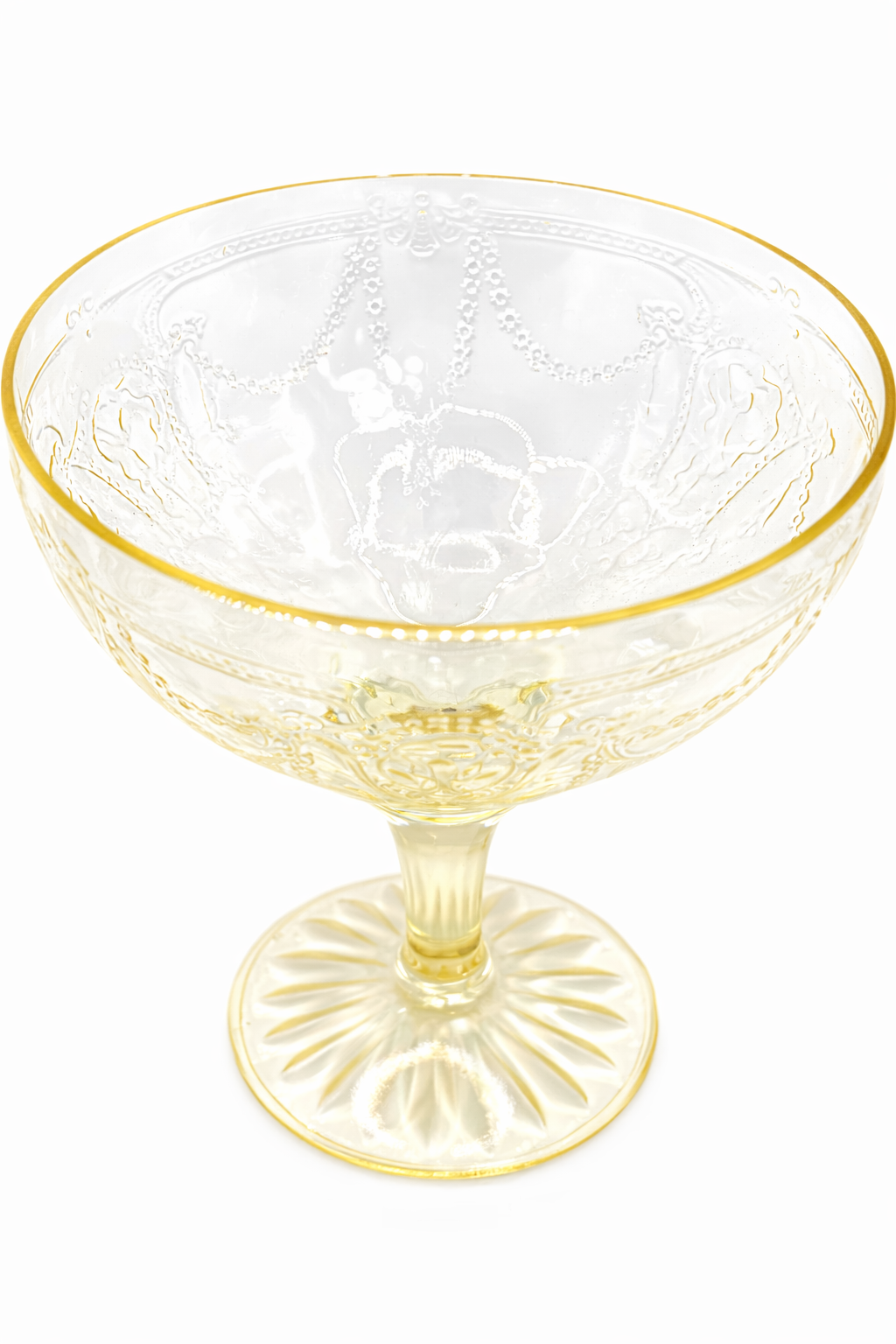 Close-up of etched floral garland and beaded detail on Anchor Hocking Cameo canary yellow Depression glass coupe