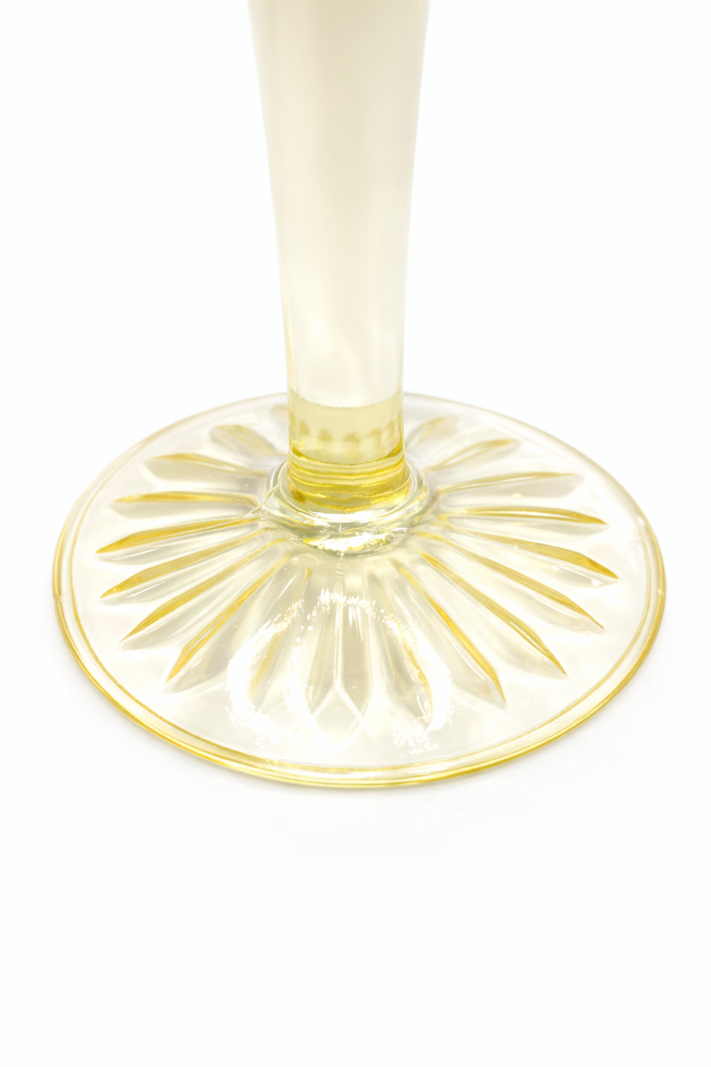Sunburst base detail on vintage Anchor Hocking Cameo canary yellow Depression glass coupe
