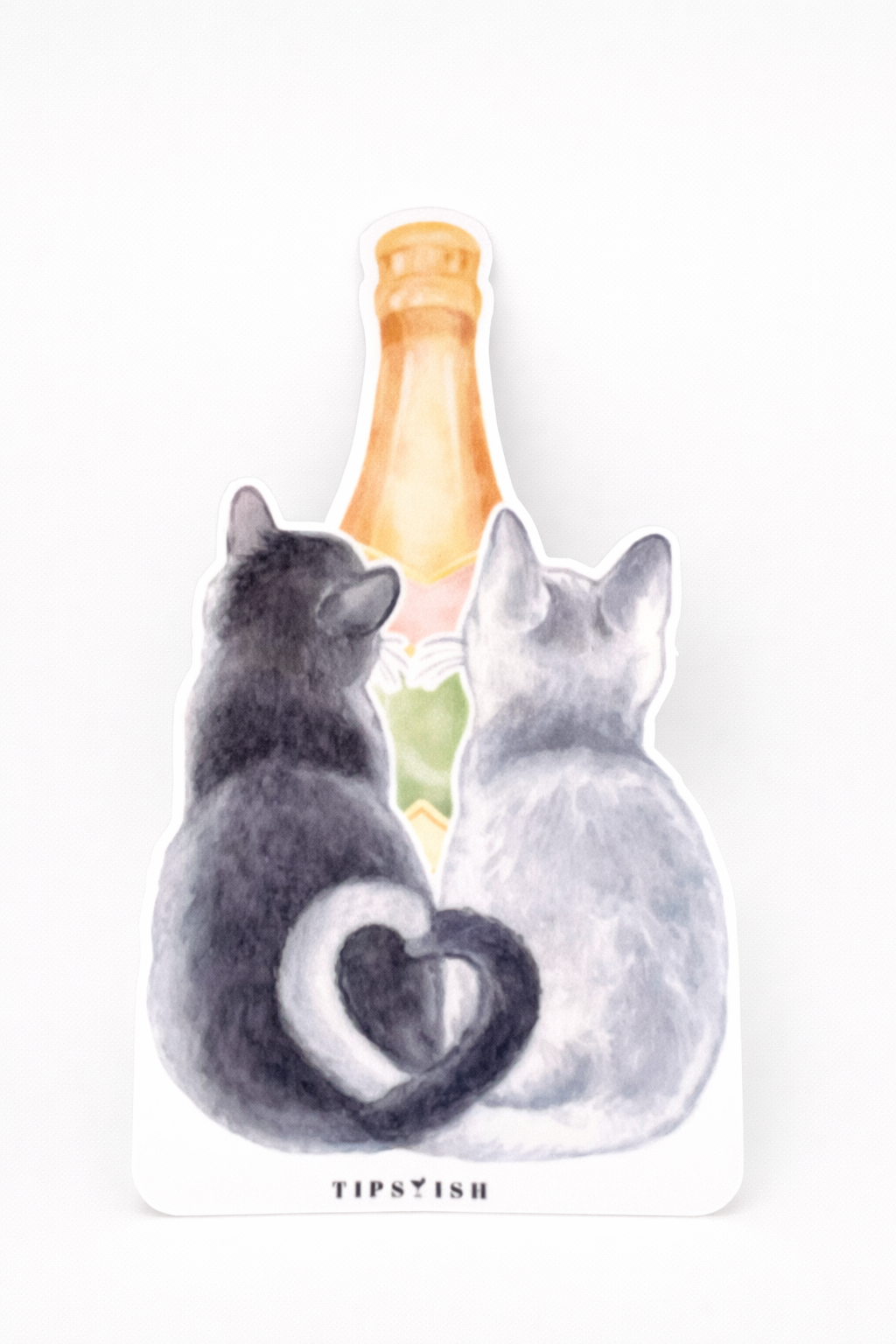 Champagne cats vinyl sticker featuring two cats sharing a bottle of bubbly with heart-shaped tails