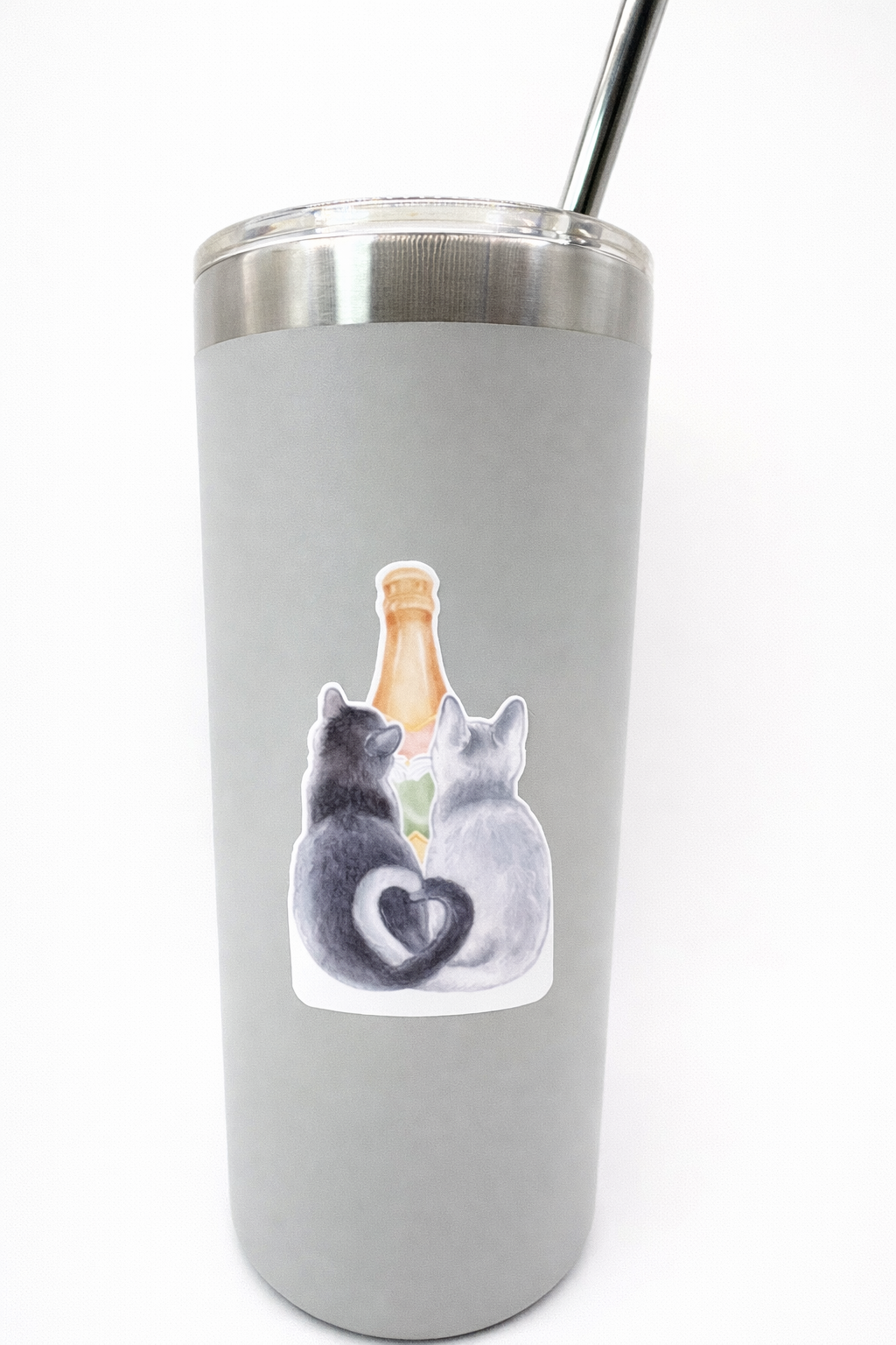 Cat and champagne vinyl sticker displayed on insulated tumbler