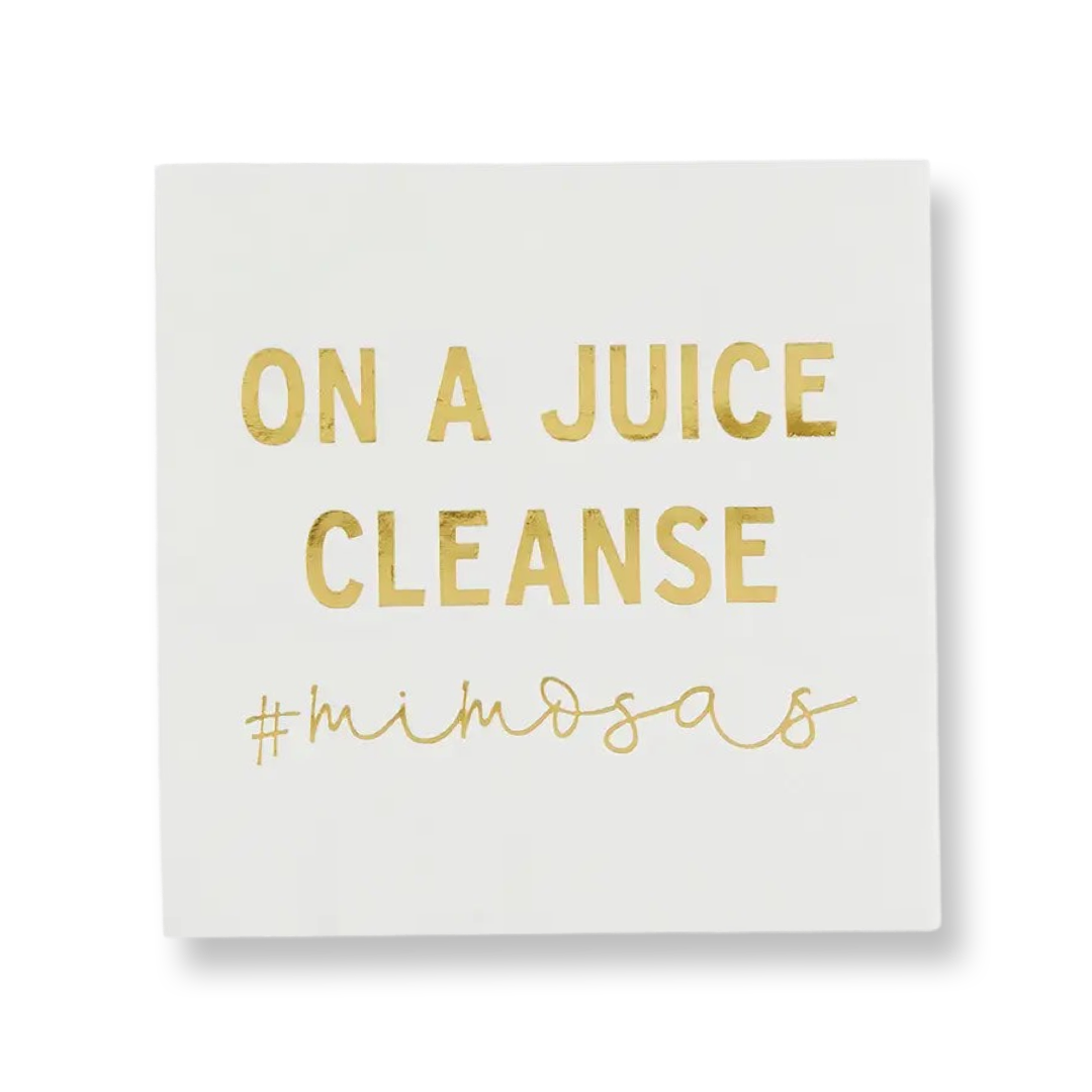 5" x 5" white square paper napkin with print in gold foil that says" On a juice cleanse, #mimosas"