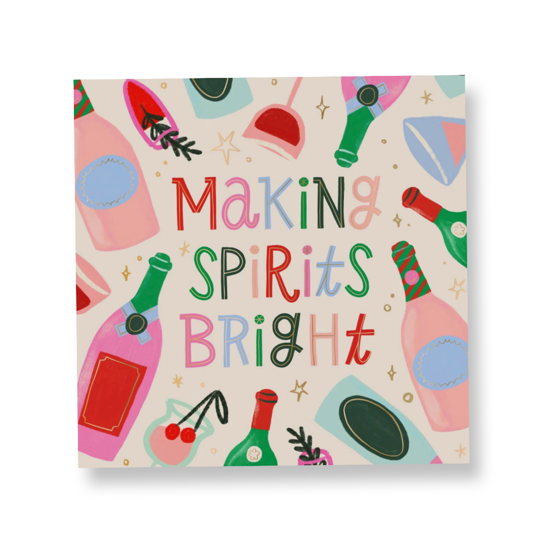 holiday cocktail napkin with a white background featuring champagne bottles and glasses in festive colors with the words "making spirits bright" featured in the center