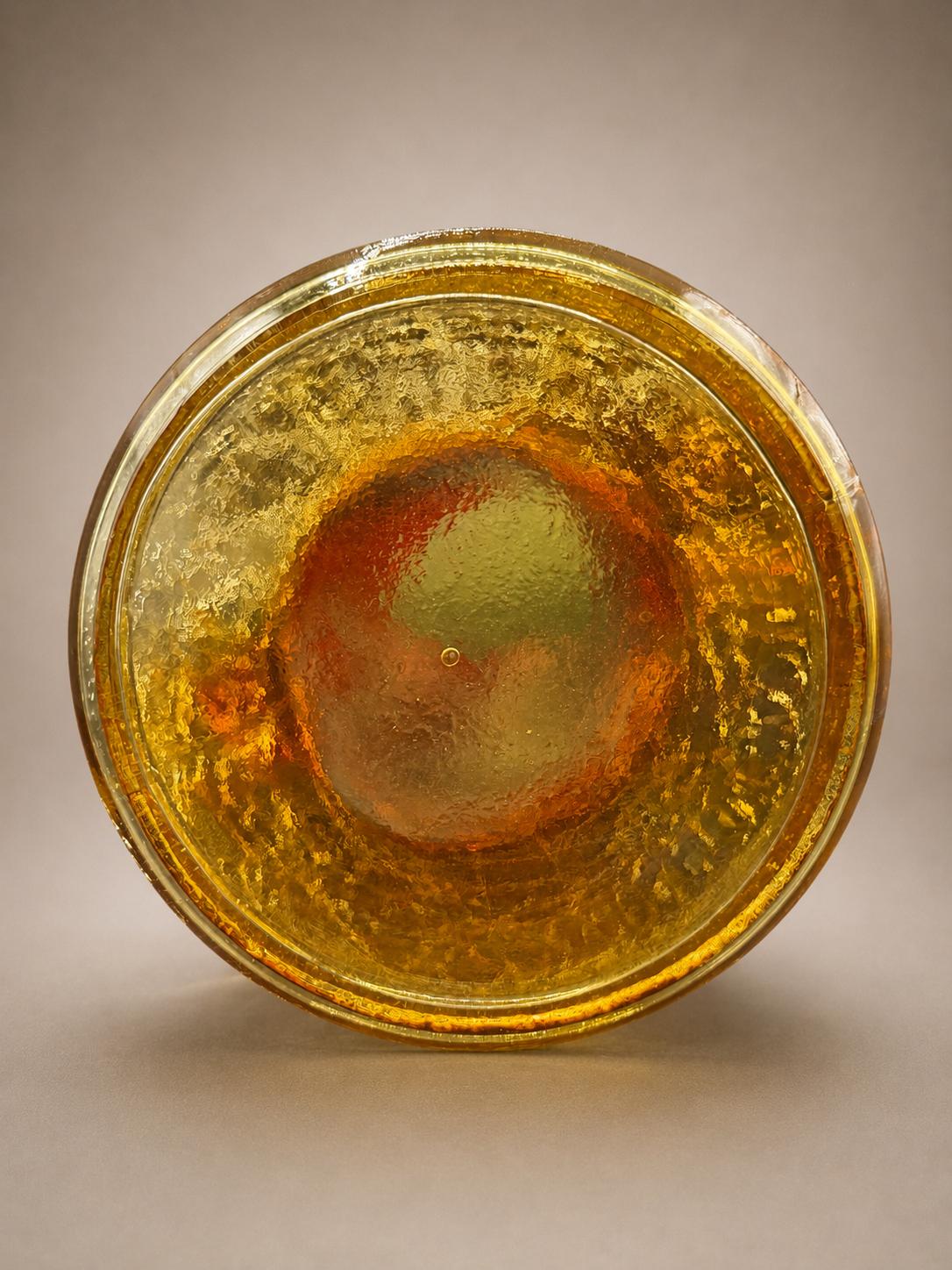 Bottom view showing the textured crackle glass and handcrafted base of the vintage Amberina pitcher.
