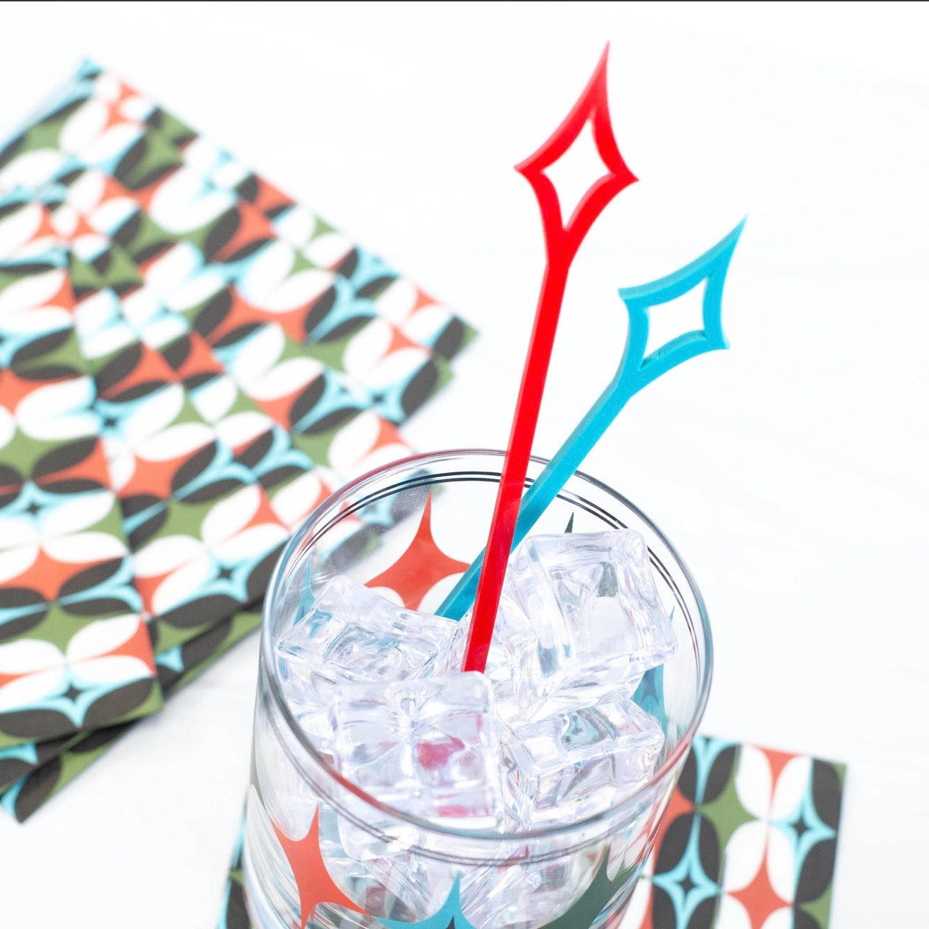 Starlight Diamond acrylic swizzle sticks styled with cocktail glassware for a retro home bar.