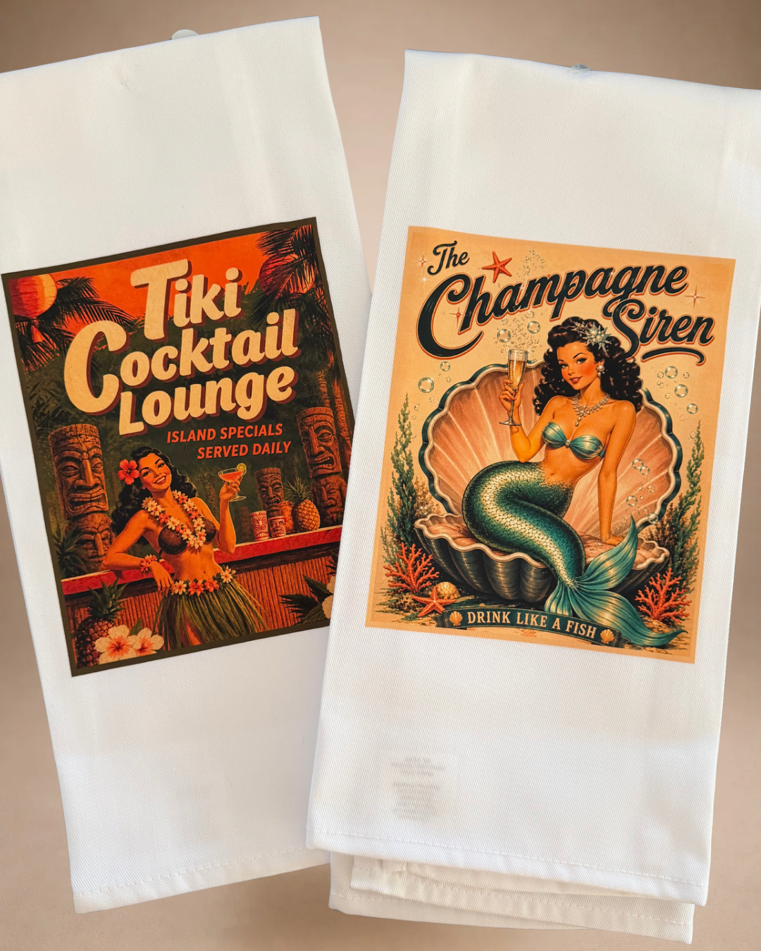 Coordinating retro cocktail tea towels featuring The Champagne Siren mermaid and Tiki Cocktail Lounge designs.