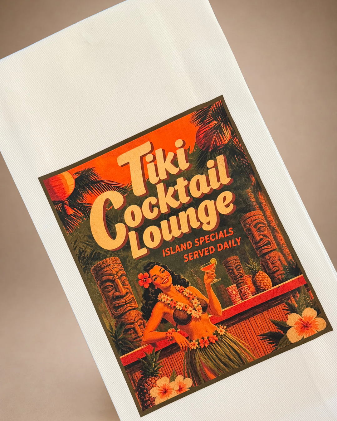Close-up of vintage-inspired Tiki Cocktail Lounge tea towel with tropical flowers, tiki decor and island cocktail artwork.