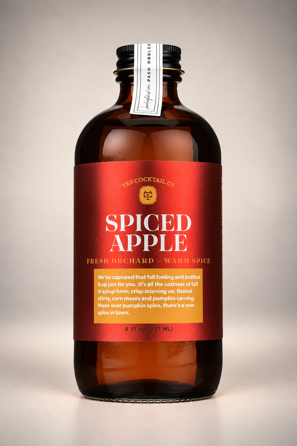 Yes Cocktail Co. Spiced Apple Syrup in an 8 oz amber glass bottle with a red label, featuring fresh orchard apple and warm spice flavors.