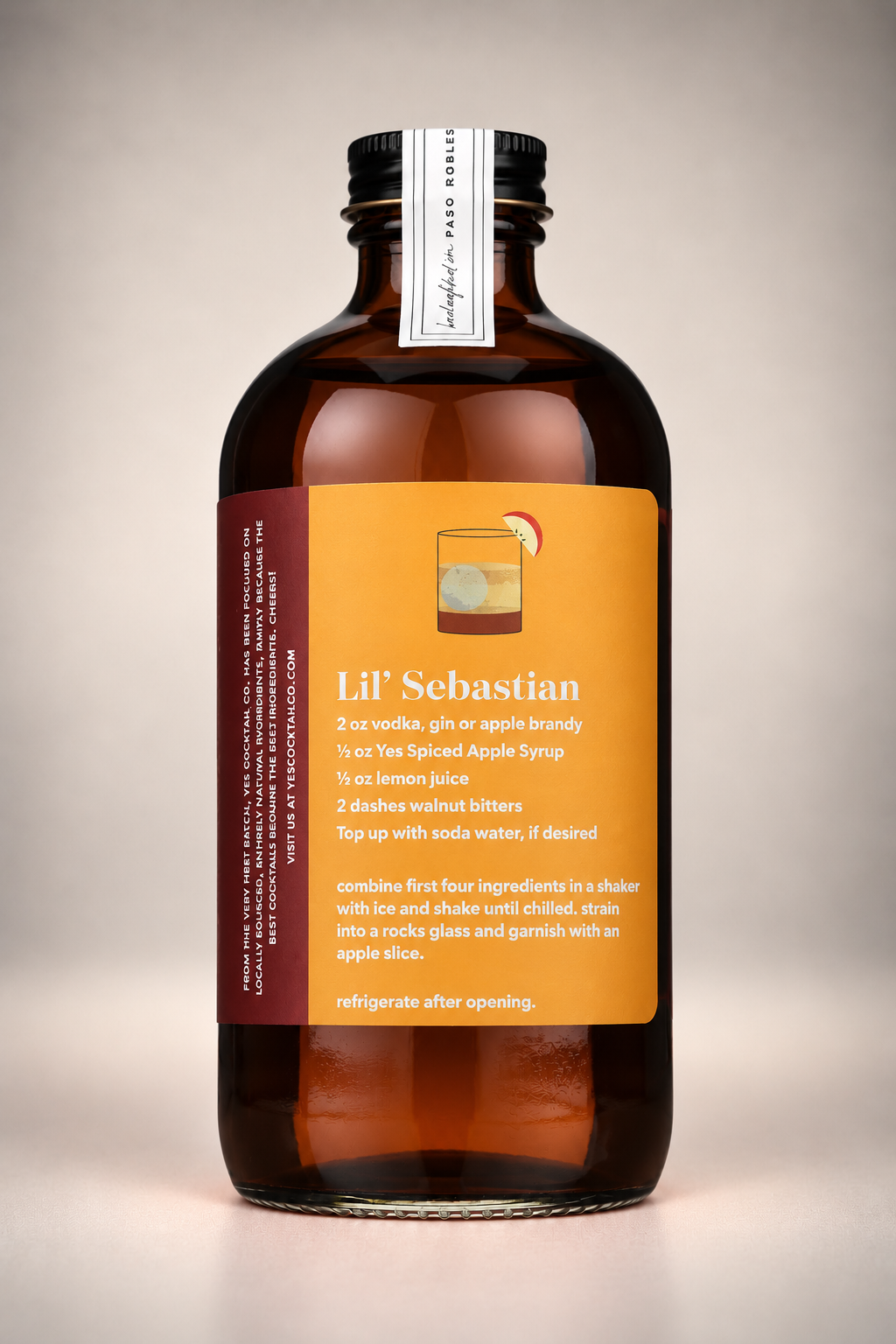Back label of Yes Cocktail Co. Spiced Apple Syrup featuring the Lil' Sebastian cocktail recipe with apple brandy, lemon juice, and walnut bitters.