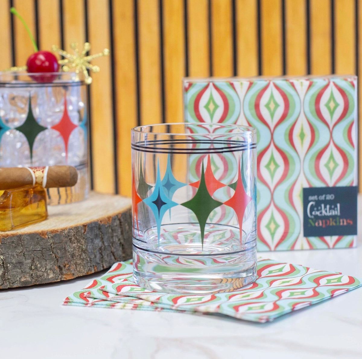 Starlight Diamond rocks and highball cocktail glasses displayed with colorful mid century modern barware and retro accessories